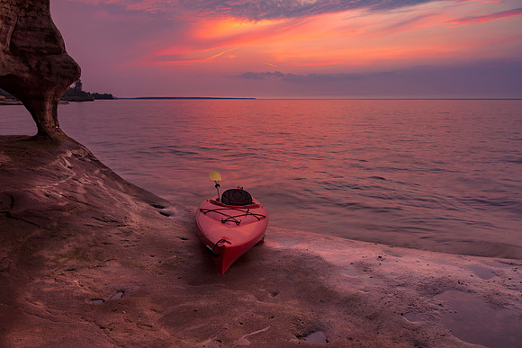 Kayak under Sunset at Lake Superior Cave